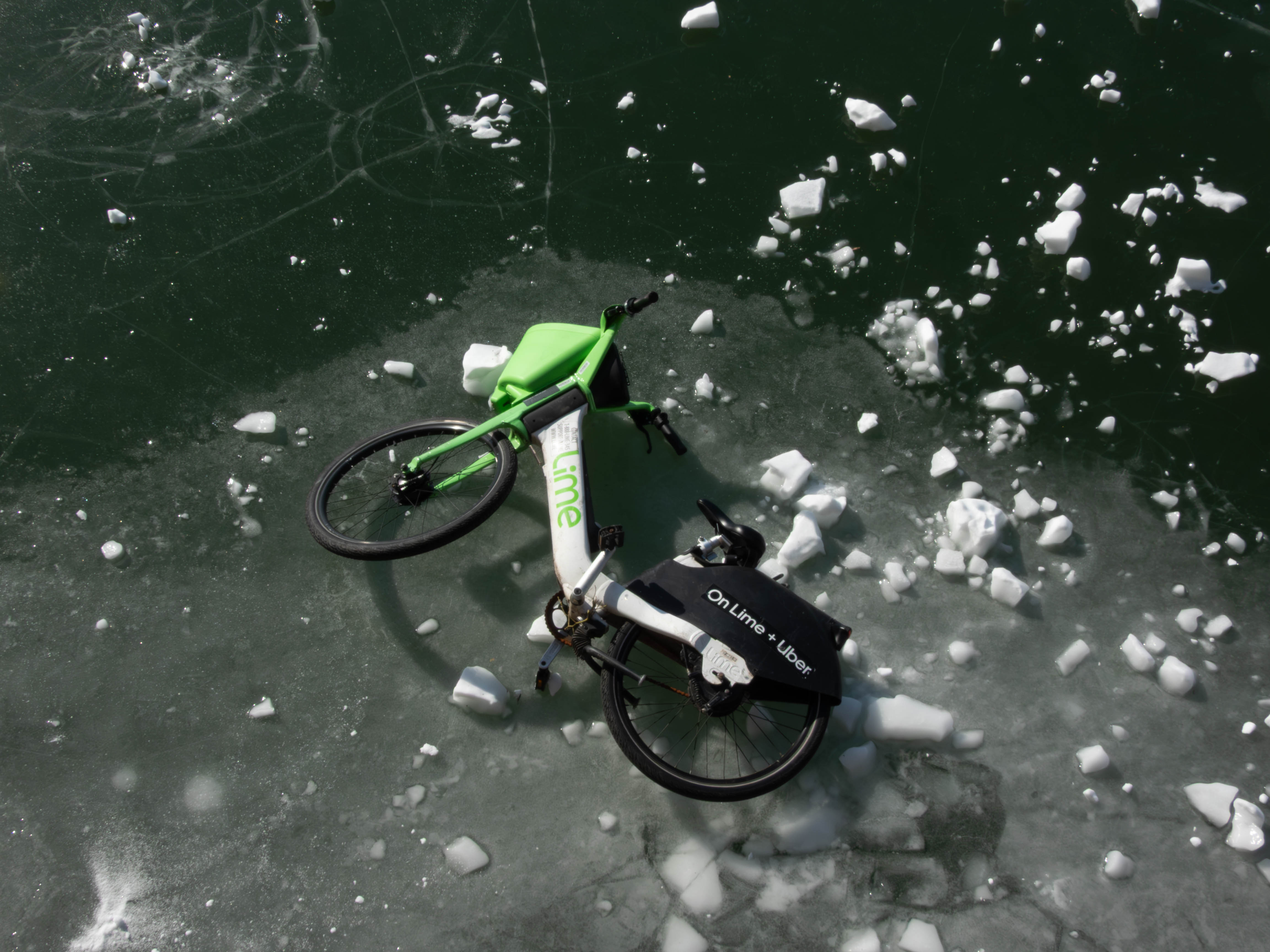 Lime bike, stuck on a frozen lake/pond