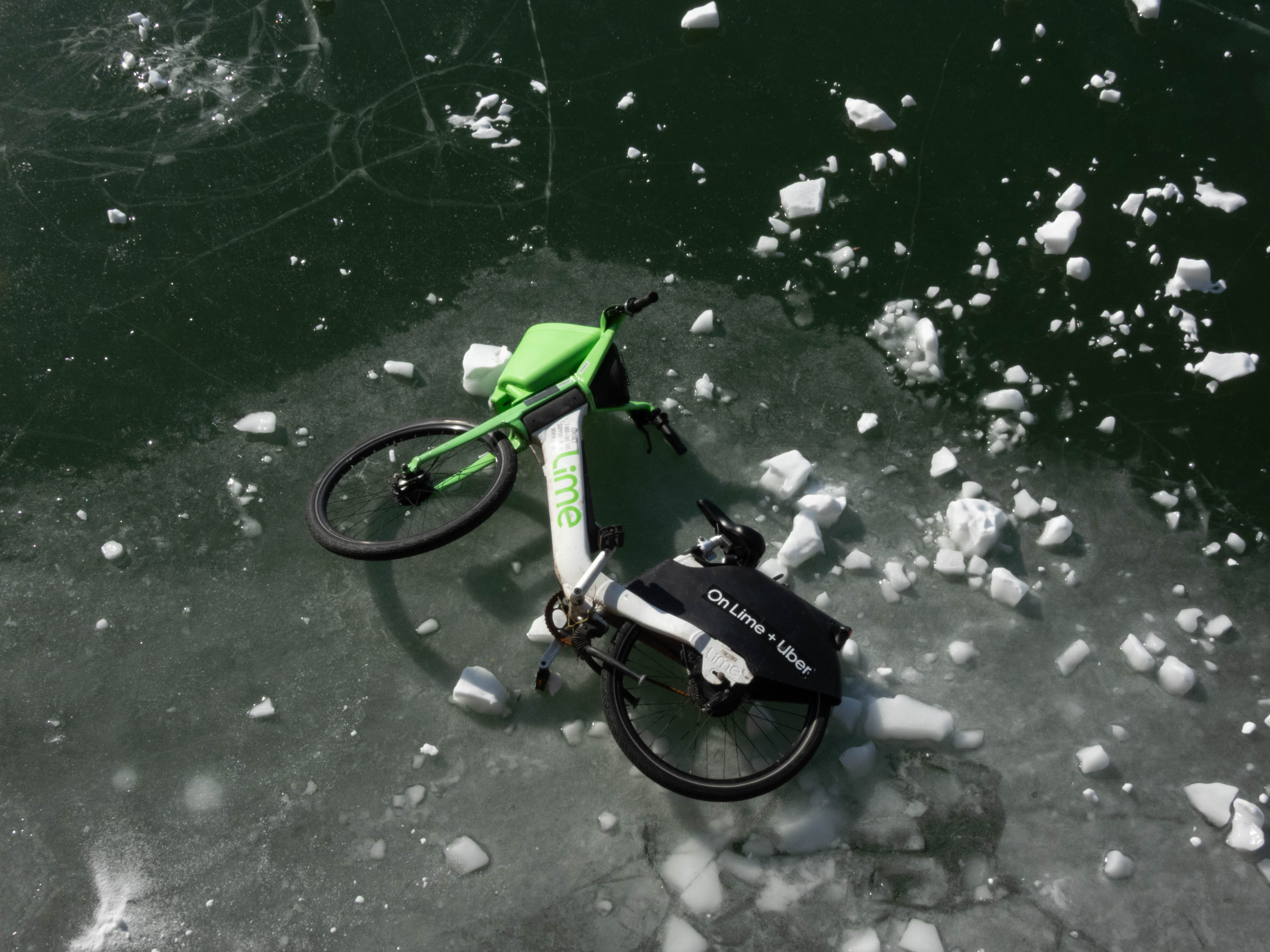 Unedited version of Lime bike, stuck on a frozen lake/pond